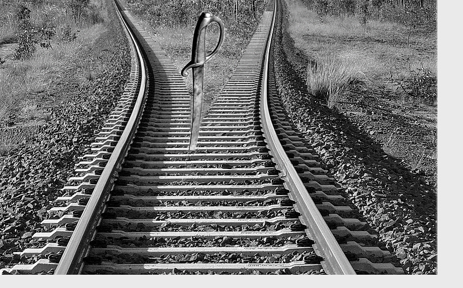 a knife between separate railroad tracks